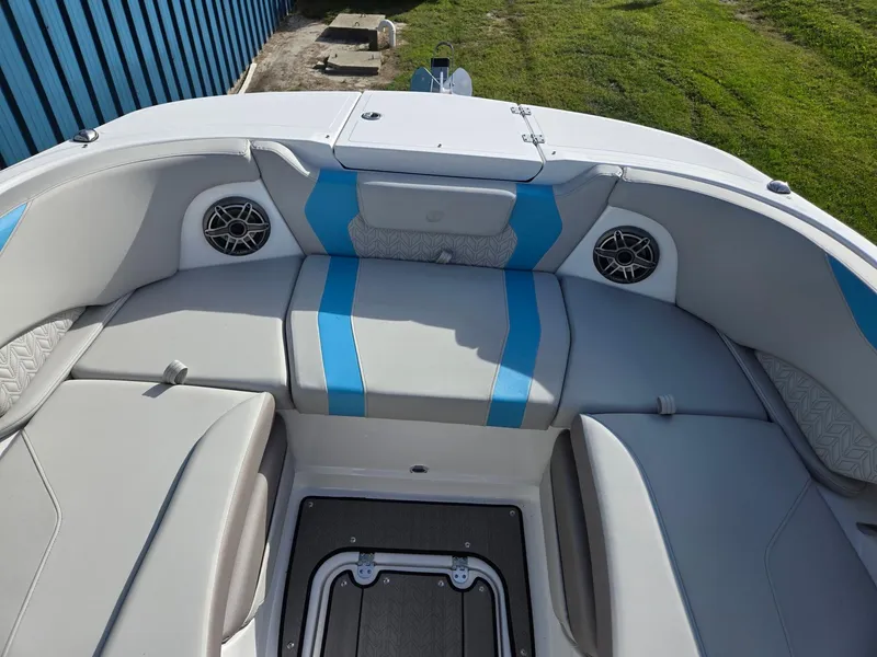 Slide: The Image of 2025 Hurricane SunDeck 2600 OB boat interior with blue and gray seating. - 41