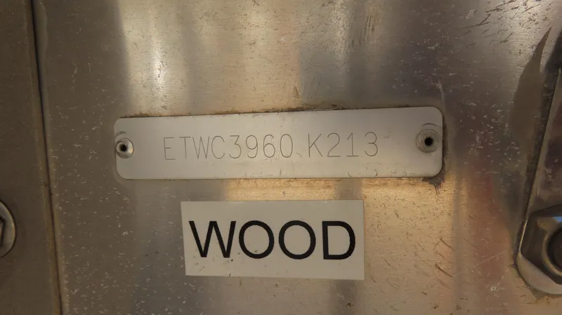 Slide: The Image of 2013 Bennington 2875 QCW I/O boat identification plate with serial number and "WOOD" label. - 12