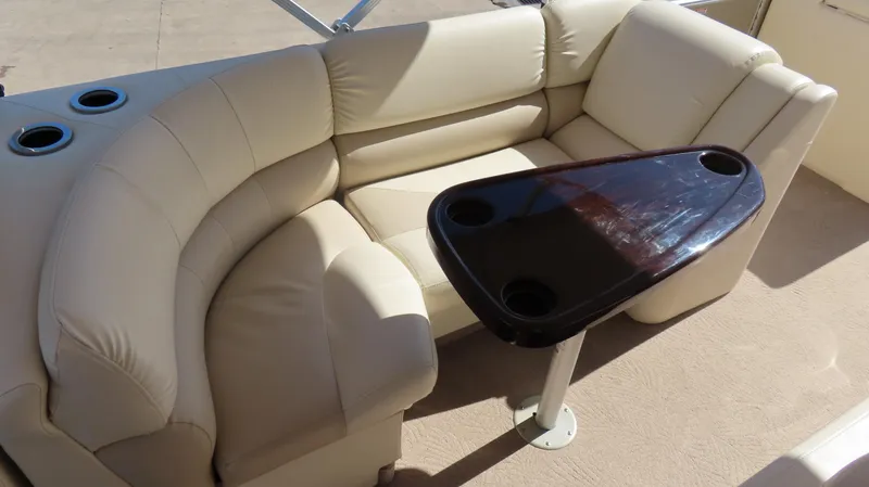 Slide: The Image of Luxurious seating area on 2013 Bennington 2875 QCW I/O boat with elegant table and cup holders. - 17