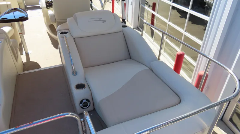 Slide: The Image of 2013 Bennington 2875 QCW I/O boat interior with comfortable seating and cup holders. - 20