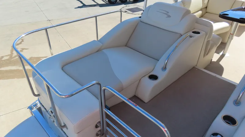 Slide: The Image of 2013 Bennington 2875 QCW I/O boat with luxurious seating and stainless steel railings. - 21
