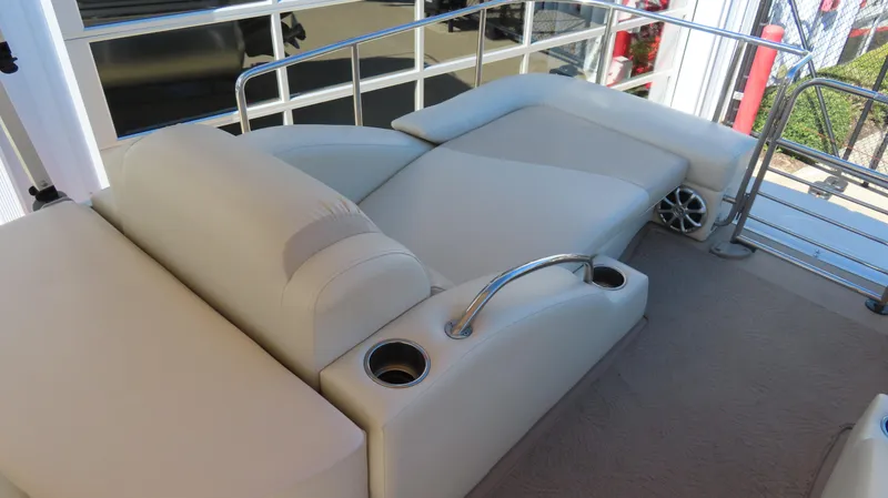 Slide: The Image of Luxurious seating on 2013 Bennington 2875 QCW I/O boat with cup holders and railing. - 26