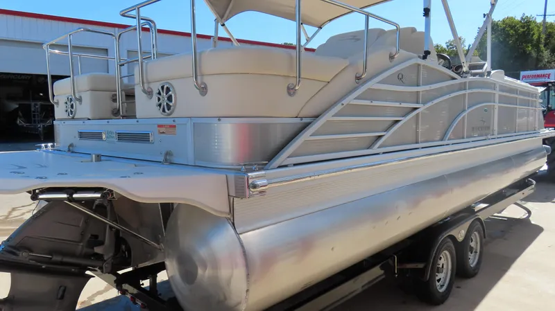 Slide: The Image of 2013 Bennington 2875 QCW I/O pontoon boat on a trailer, side view. - 8
