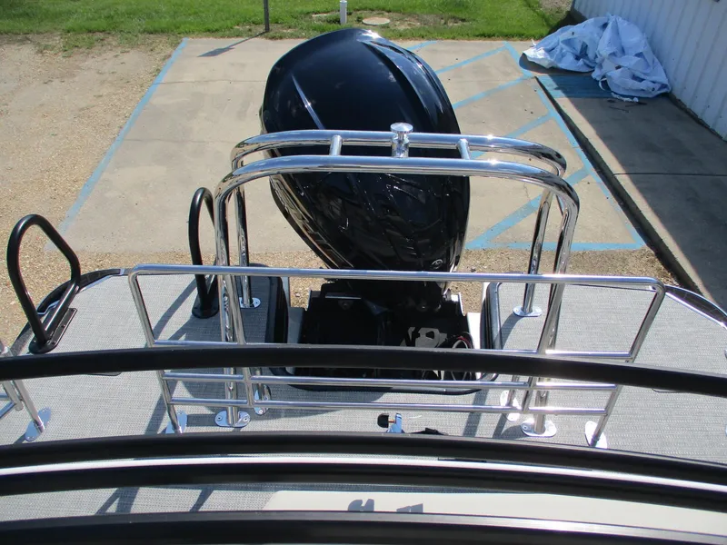 Slide: The Image of Starcraft EXS-3DL 2025 boat with sleek outboard motor and chrome railings. - 10