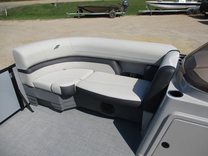 Slide: The Image of 2025 Starcraft EXS-3DL boat interior with gray seating and carpeted floor. - 12