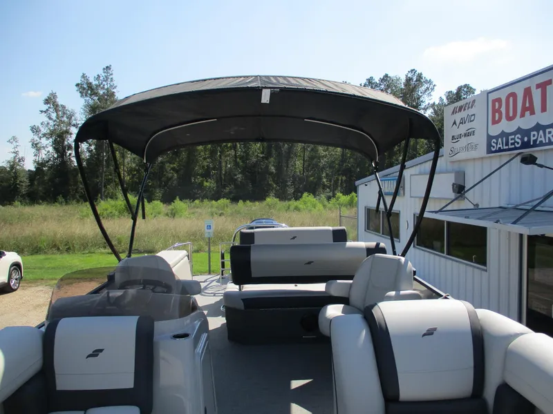 Slide: The Image of 2025 Starcraft EXS-3DL pontoon boat with canopy at dealership. - 21