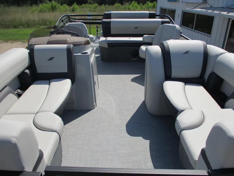 Slide: The Image of 2025 Starcraft EXS-3DL pontoon boat interior with plush seating and modern design. - 3