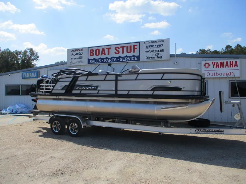 Slide: The Image of 2025 Starcraft EXS-3DL pontoon boat on trailer at dealership. - 4