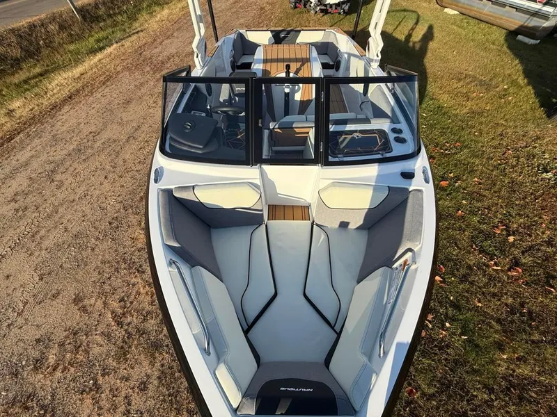 Slide: The Image of 2025 Nautique Ski 200 Open Bow boat with sleek design and spacious seating. - 17