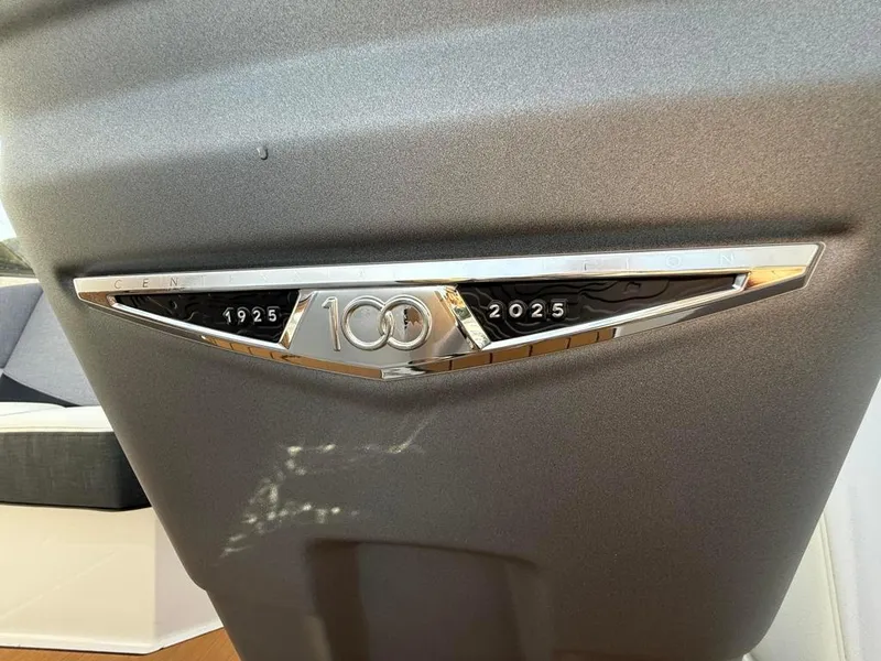 Slide: The Image of 2025 Nautique Ski 200 Open Bow, 100th anniversary emblem, sleek design. - 32