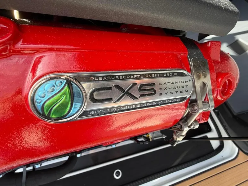 Slide: The Image of Close-up of 2025 Nautique Ski 200 Open Bow engine with CXS Cataniumm exhaust system. - 36