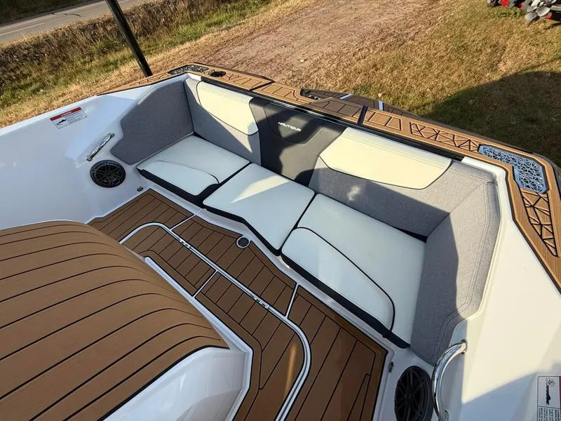Slide: The Image of 2025 Nautique Ski 200 Open Bow with stylish seating and teak flooring. - 39