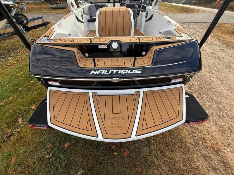 Slide: The Image of 2025 Nautique Ski 200 Open Bow boat with teak deck and sleek design. - 44