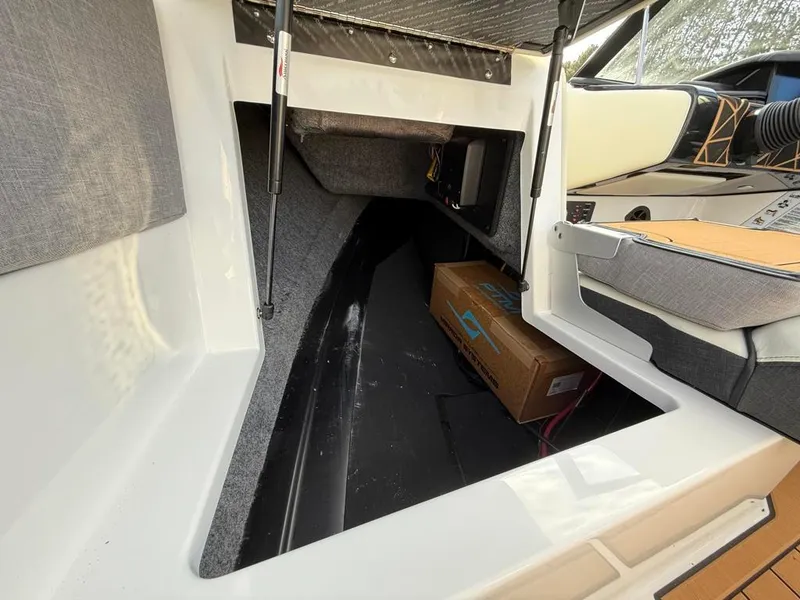 Slide: The Image of 2025 Nautique Ski 200 Open Bow interior storage compartment. - 50