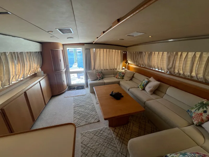 Slide: The Image of Luxurious interior of 1989 Bertram 50 Convertible yacht with plush seating and elegant decor. - 17