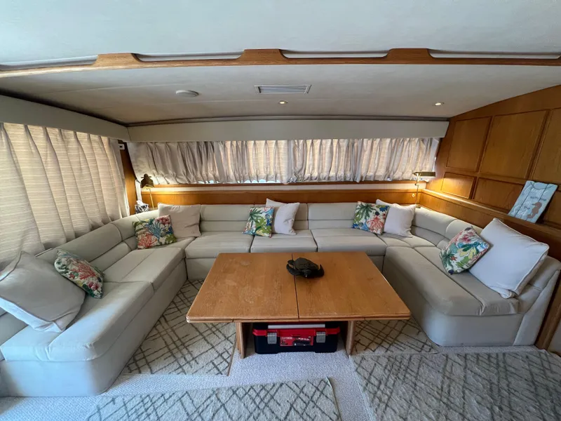 Slide: The Image of Luxurious interior of 1989 Bertram 50 Convertible yacht with plush seating and wooden accents. - 18