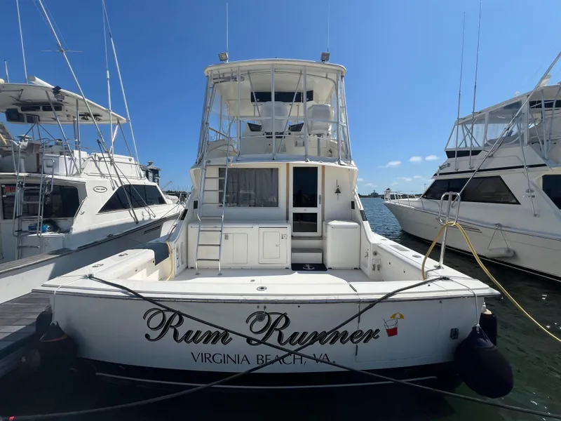 Slide: The Image of 1989 Bertram 50 Convertible yacht "Rum Runner" docked in Virginia Beach marina. - 2