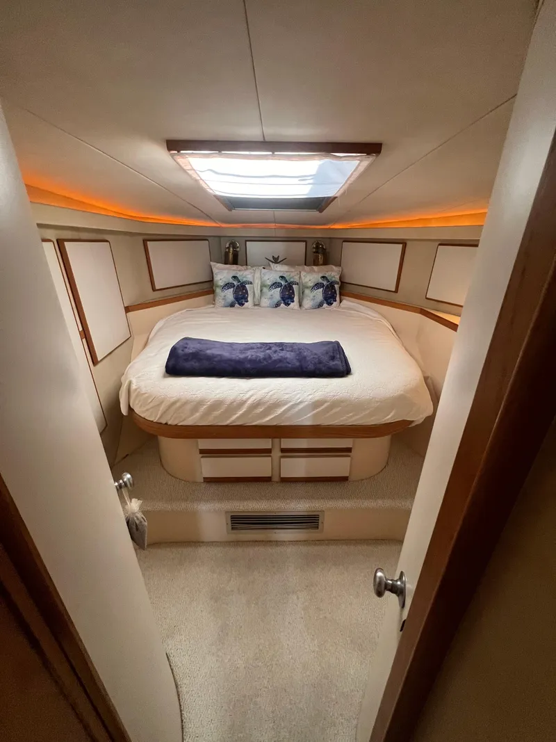 Slide: The Image of Cozy bedroom in 1989 Bertram 50 Convertible yacht with skylight and ambient lighting. - 34