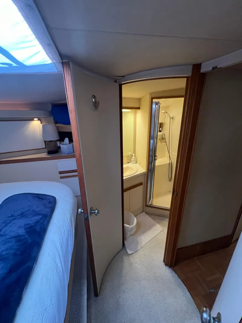 Slide: The Image of 1989 Bertram 50 Convertible yacht interior with bedroom and bathroom. - 39