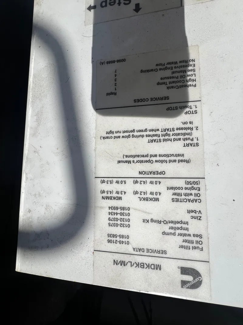 Slide: The Image of Instruction label on a 1989 Bertram 50 Convertible boat engine. - 41