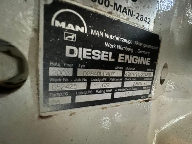 Slide: The Image of MAN diesel engine label on a 1989 Bertram 50 Convertible boat. - 49