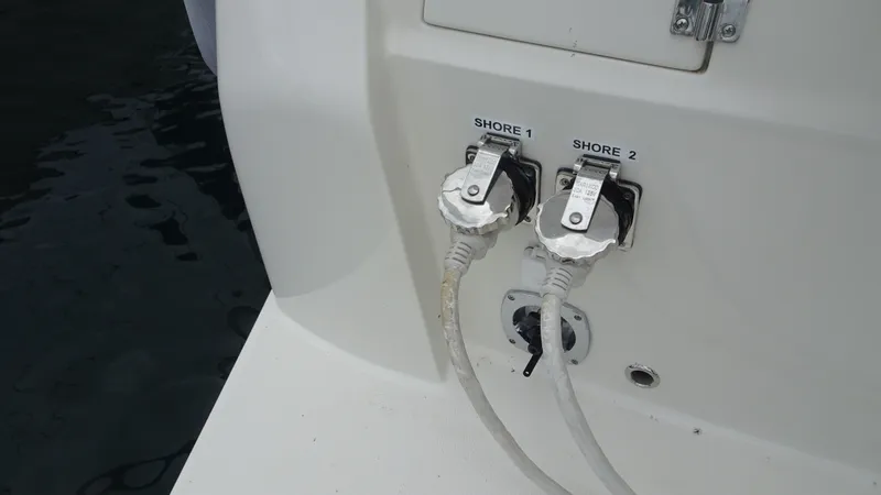 Slide: The Image of Shore power connections on a 2018 Carver C34 Coupe boat. - 11