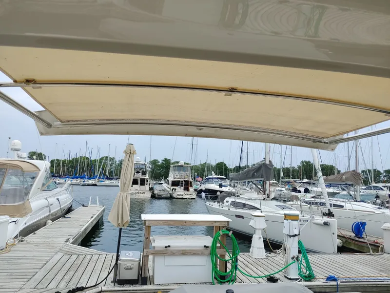 Slide: The Image of Marina view with boats docked, featuring a 2018 Carver C34 Coupe. - 17