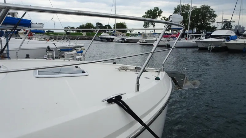 Slide: The Image of 2018 Carver C34 Coupe yacht docked in a marina with other boats. - 3