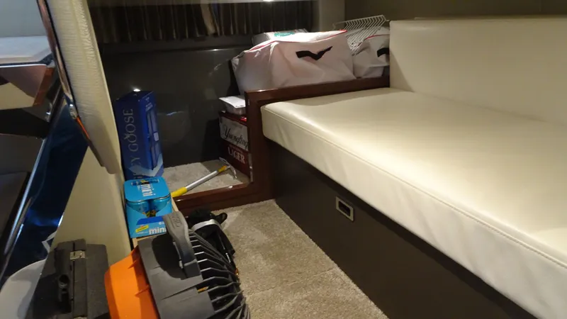 Slide: The Image of Interior of 2018 Carver C34 Coupe with storage and seating area. - 38