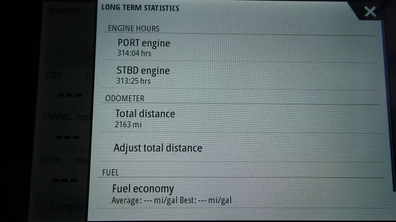 Slide: The Image of Display screen showing engine hours and odometer for 2018 Carver C34 Coupe. - 46