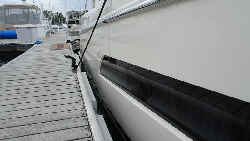 Slide: The Image of 2018 Carver C34 Coupe yacht docked at marina, side view. - 5