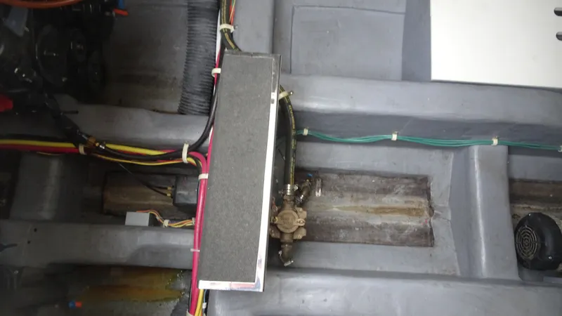 Slide: The Image of Engine compartment of a 2018 Carver C34 Coupe with visible wiring and components. - 41