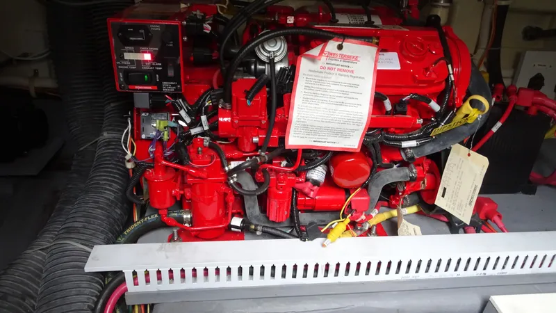 Slide: The Image of Engine compartment of a 2018 Carver C34 Coupe with red mechanical components. - 42