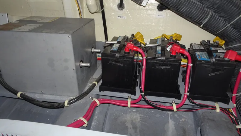 Slide: The Image of Battery compartment of a 2018 Carver C34 Coupe with wiring and components. - 50