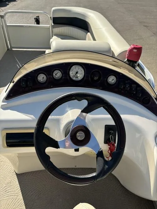 Slide: The Image of 2008 Bennington 2075GSi boat dashboard with steering wheel and gauges. - 10