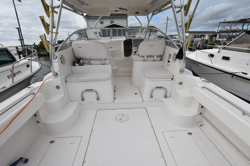 Slide: The Image of 2007 Seaswirl Striper 2901 Walkaround O/B boat interior with seating and helm. - 10