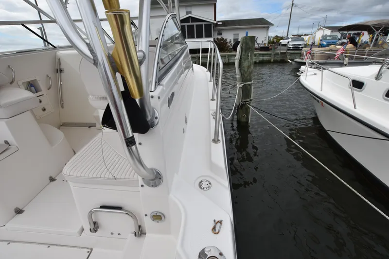 Slide: The Image of 2007 Seaswirl Striper 2901 Walkaround O/B docked at marina, side view. - 13