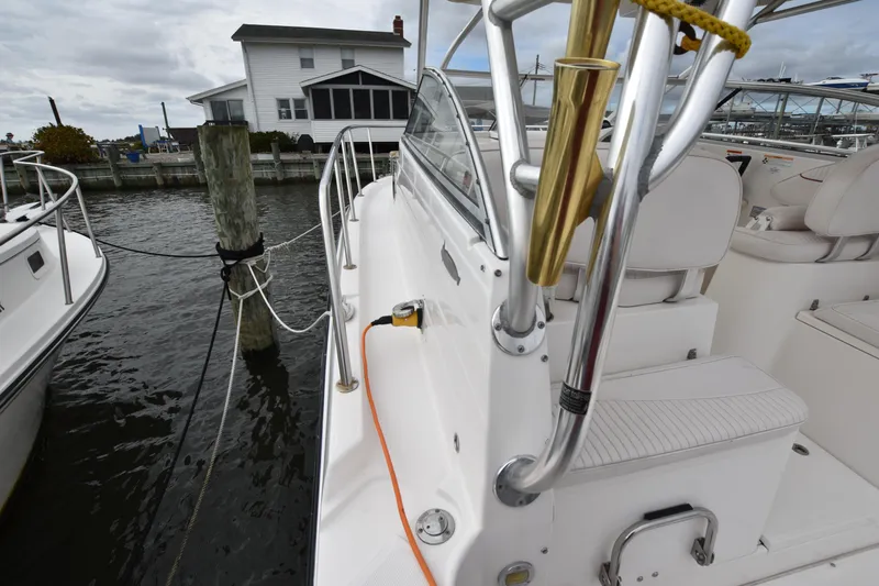 Slide: The Image of 2007 Seaswirl Striper 2901 Walkaround O/B docked near waterfront home. - 14