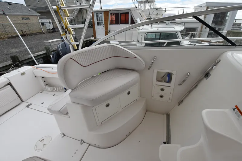 Slide: The Image of 2007 Seaswirl Striper 2901 Walkaround O/B boat interior with seating and storage. - 17