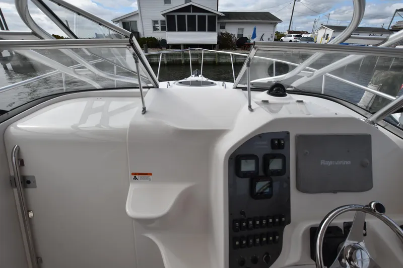 Slide: The Image of 2007 Seaswirl Striper 2901 Walkaround O/B boat dashboard with navigation controls. - 23