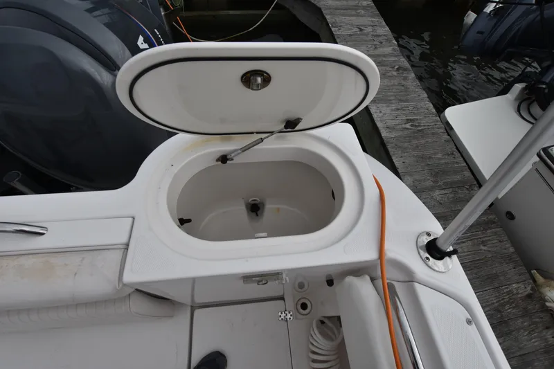 Slide: The Image of 2007 Seaswirl Striper 2901 Walkaround O/B boat with open storage compartment. - 27