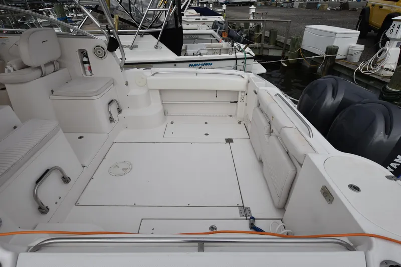 Slide: The Image of 2007 Seaswirl Striper 2901 Walkaround O/B boat deck with seating and twin outboard motors. - 4