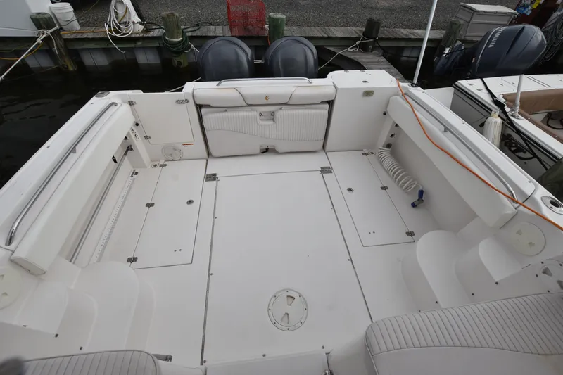 Slide: The Image of 2007 Seaswirl Striper 2901 Walkaround O/B boat deck, spacious seating, and storage compartments. - 5