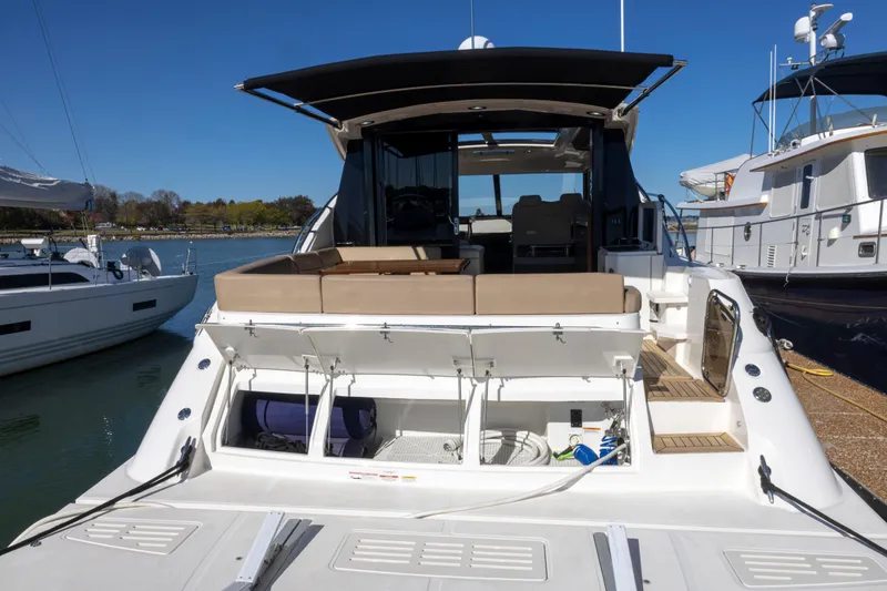 Slide: The Image of 2016 Sea Ray 510 Sundancer yacht with open deck and storage compartments. - 22