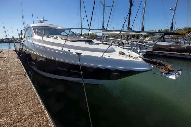Slide: The Image of 2016 Sea Ray 510 Sundancer yacht docked in marina, side view. - 26