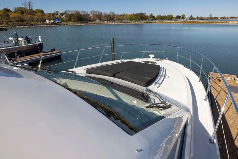 Slide: The Image of 2016 Sea Ray 510 Sundancer yacht docked by serene waters. - 27