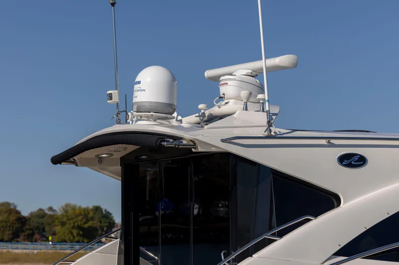 Slide: The Image of 2016 Sea Ray 510 Sundancer yacht with advanced radar equipment on deck. - 33