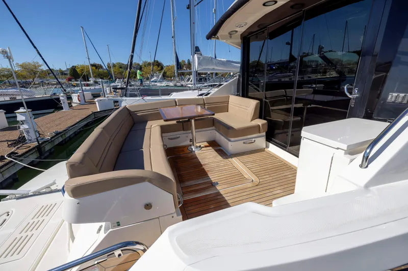 Slide: The Image of 2016 Sea Ray 510 Sundancer yacht with spacious outdoor seating and elegant design. - 37
