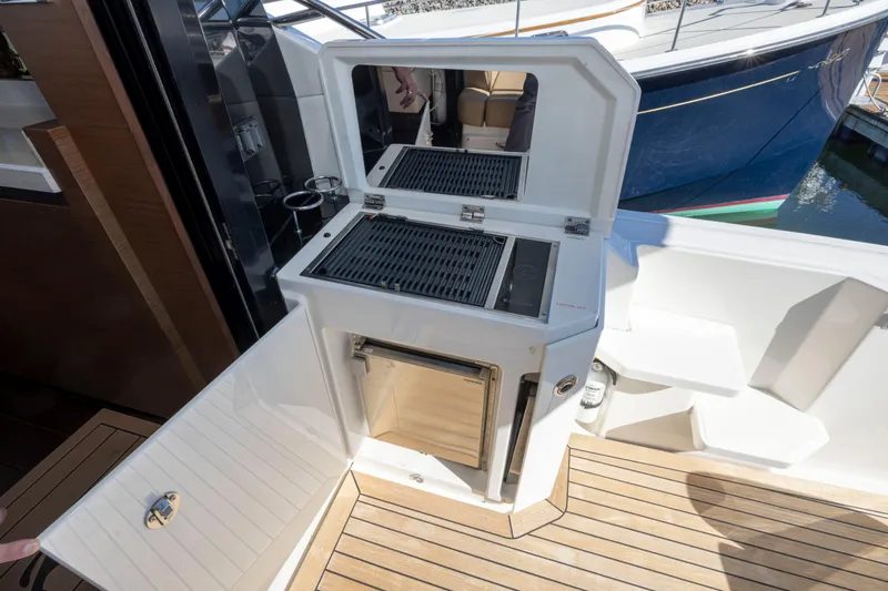 Slide: The Image of Outdoor grill and storage on 2016 Sea Ray 510 Sundancer yacht deck. - 40