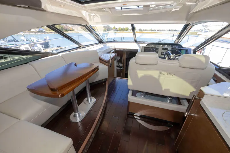 Slide: The Image of Luxurious interior of 2016 Sea Ray 510 Sundancer yacht with elegant seating and helm. - 44
